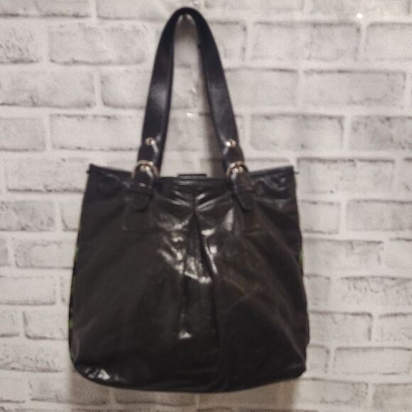 Brown and Black Shoulder Bag with Durable Fabric and Decorative Tassels - Picture 3 of 6